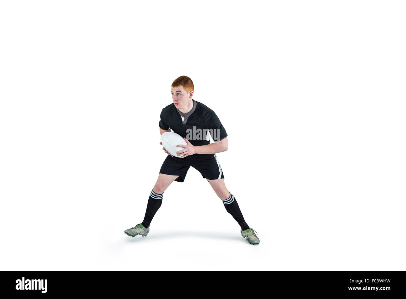 Rugby player running with a rugby ball Stock Photo