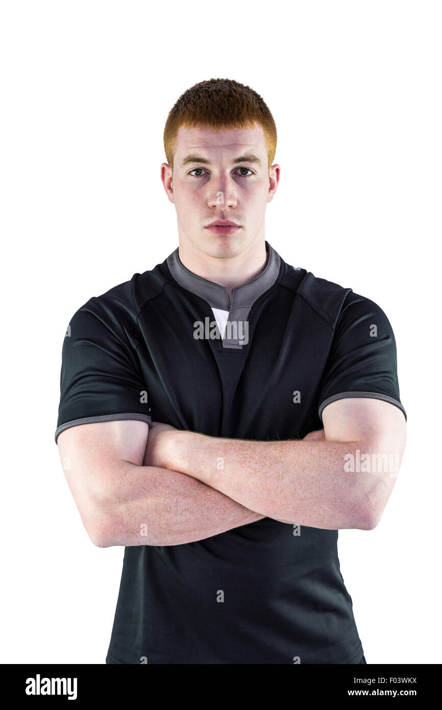 Rugby player with arms crossed Stock Photo