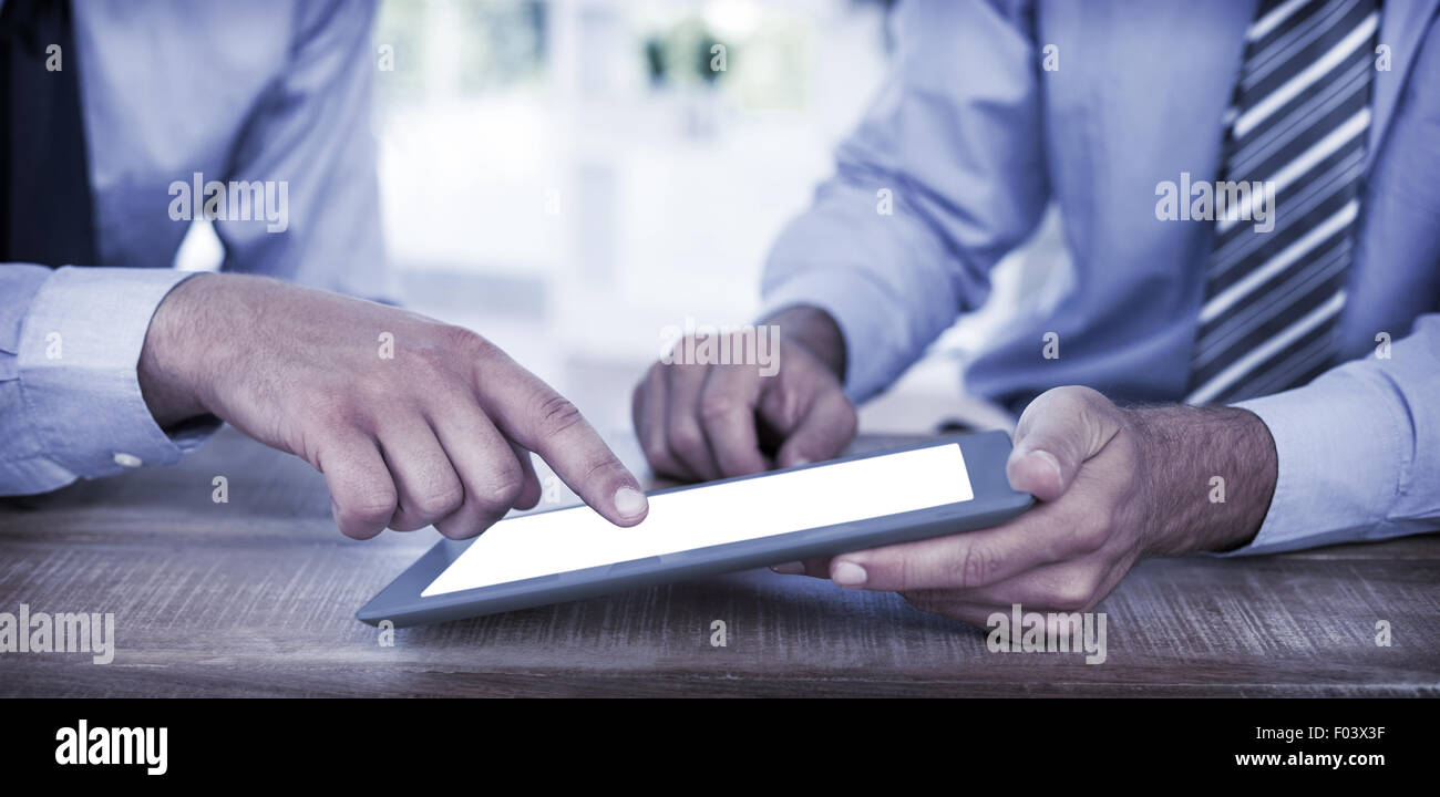 Businessmen using tablet Stock Photo - Alamy