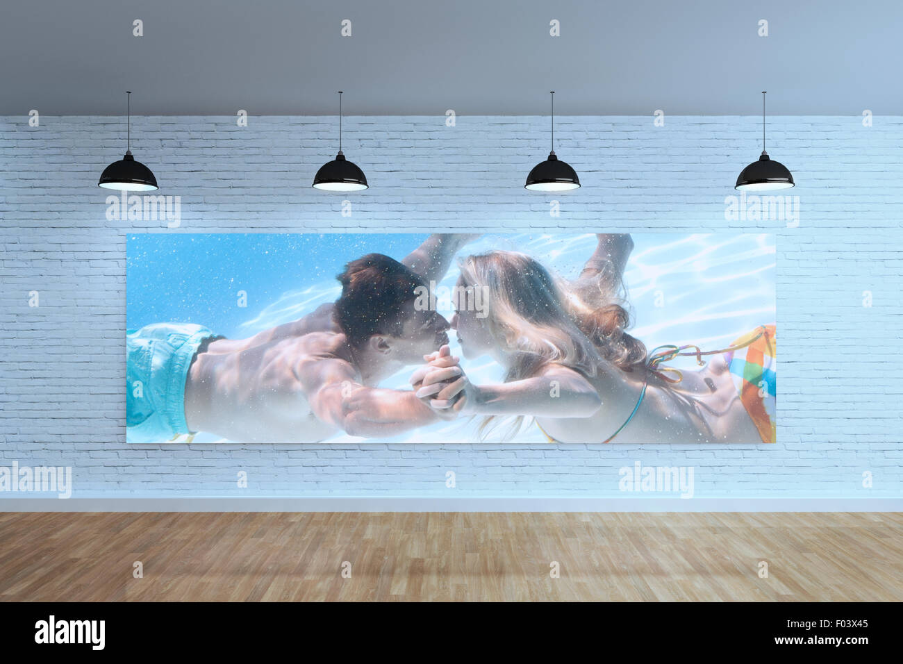 Composite image of cute couple kissing underwater in the swimming pool Stock Photo