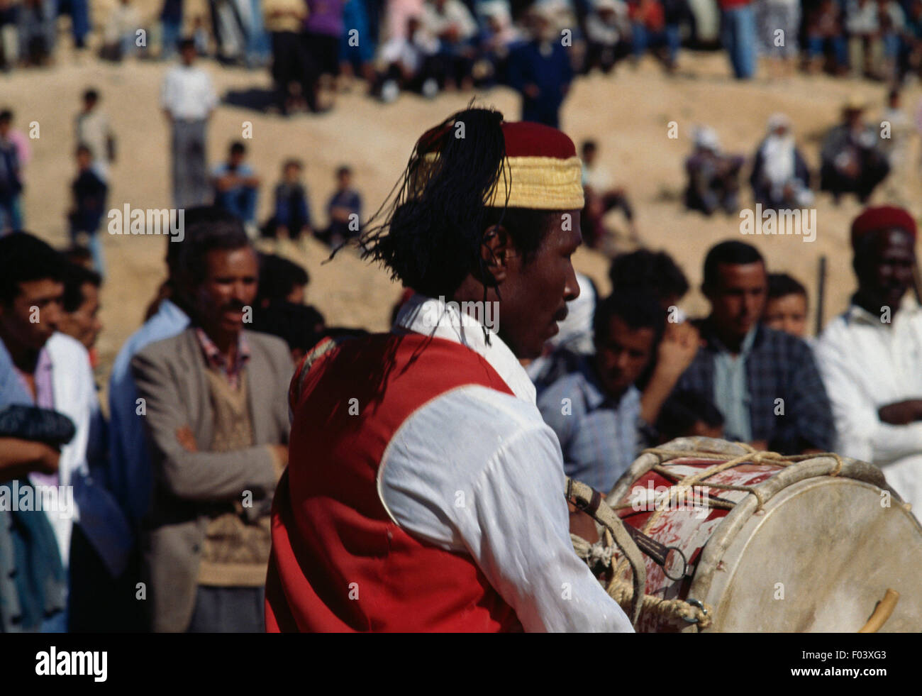 Man in traditional clothes playing the drum, Matmata Berber festival, Tunisia. Stock Photo