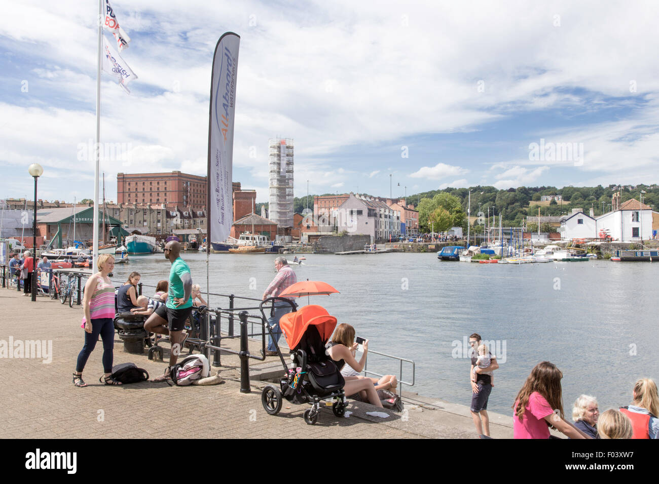 People enjoying Bristol Harbourside waterfront, Bristol, England, UK Stock Photo
