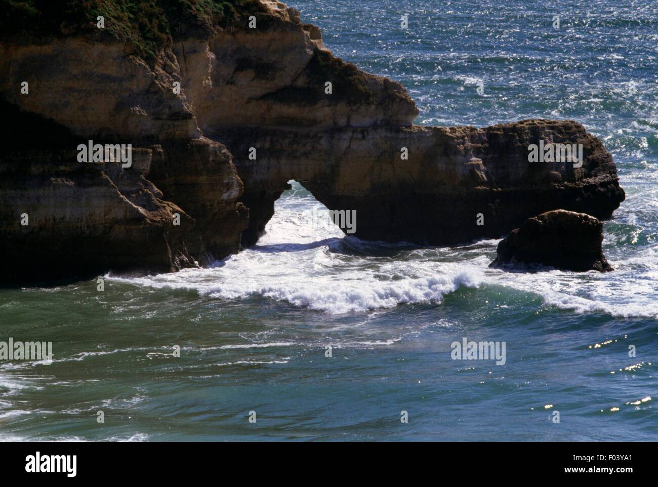 Natural arch along the Atlantic coast, Praia da Rocha, Algarve ...