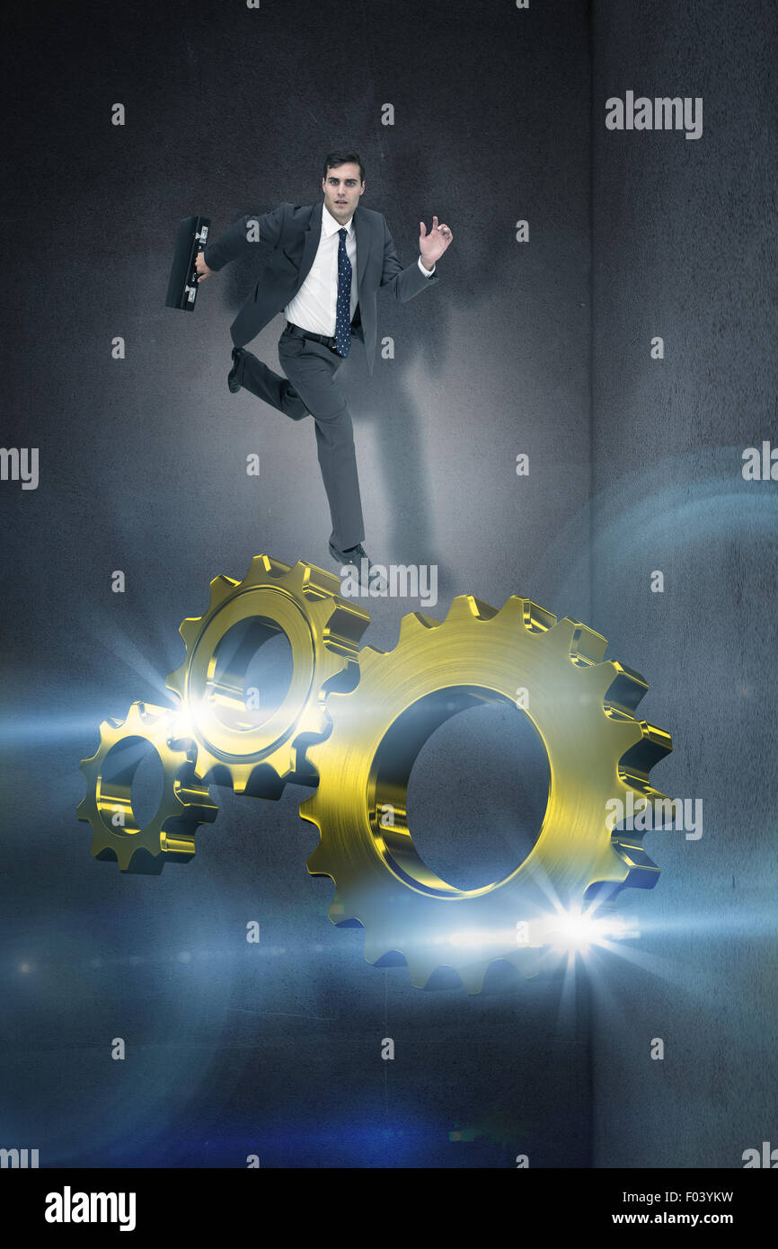 Composite image of stern businessman in a hurry Stock Photo
