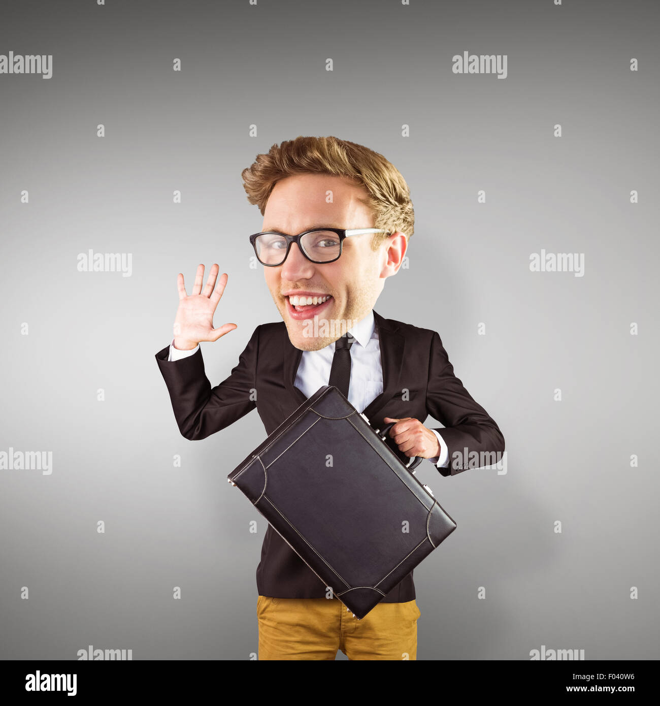 Composite image of nerd smiling and waving Stock Photo