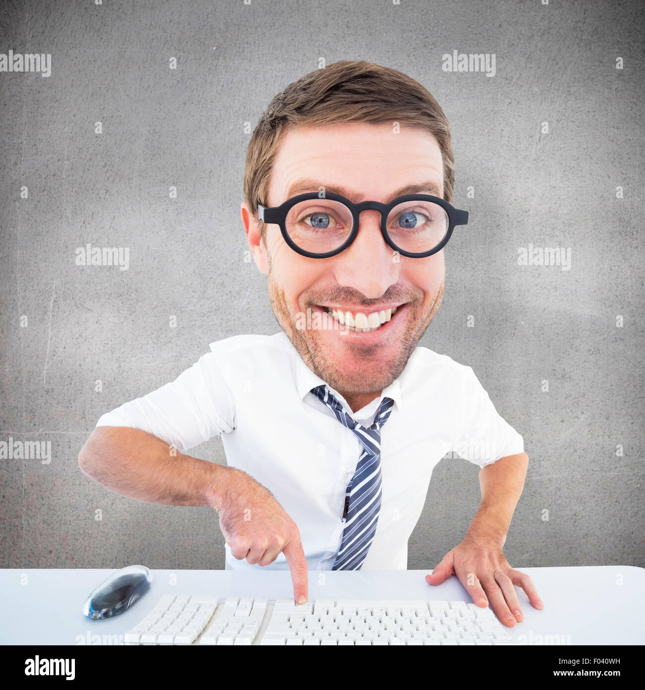Composite image of geeky businessman typing Stock Photo