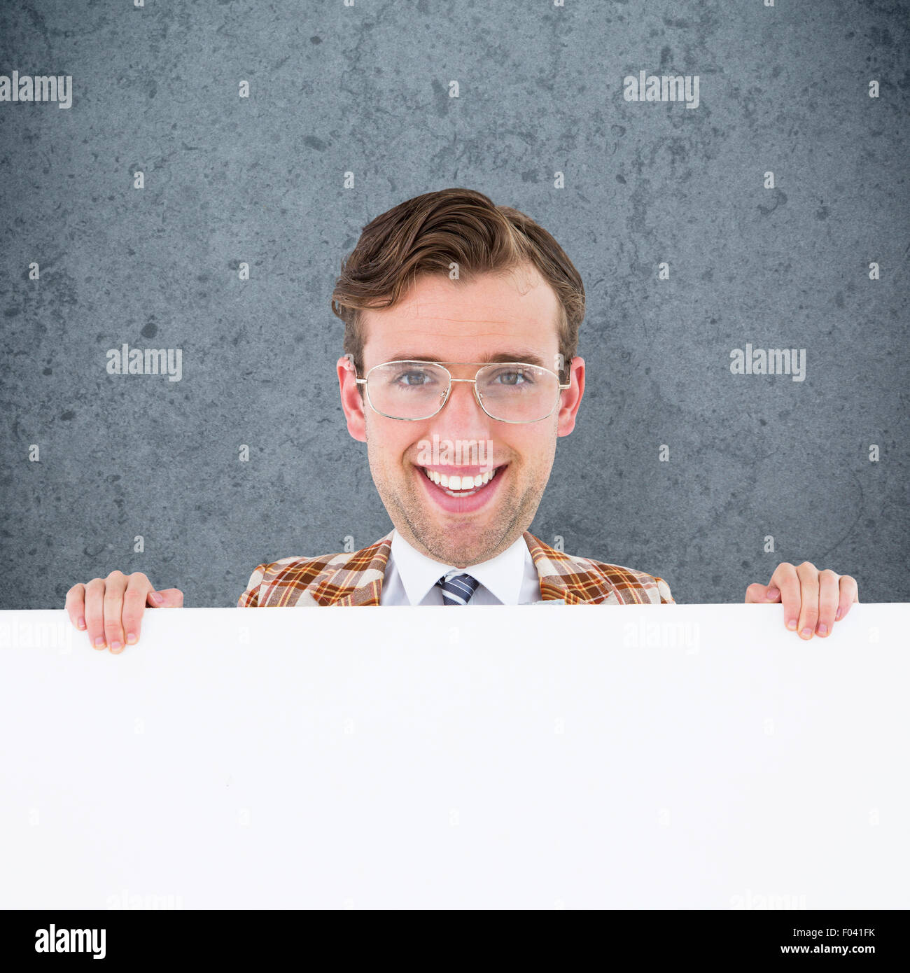Composite image of geeky businessman showing card Stock Photo