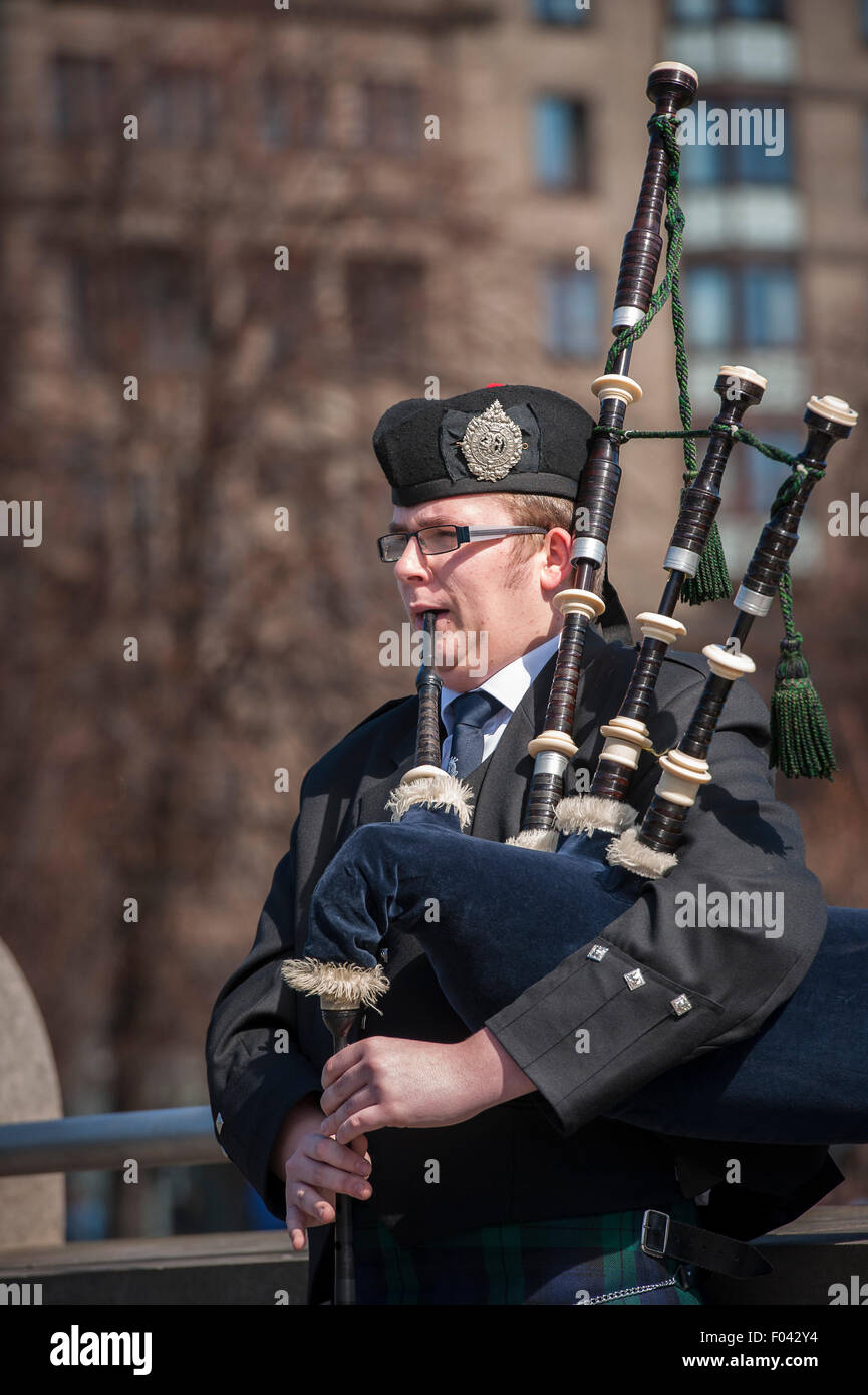 Man playing the bagpipes in Edinburgh, Scotland. Stock Photo