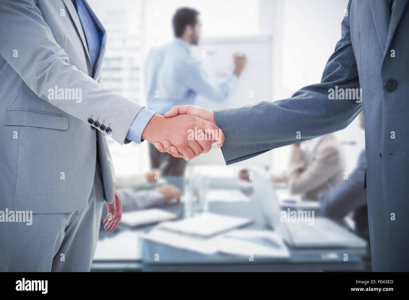 Composite image of business handshake Stock Photo
