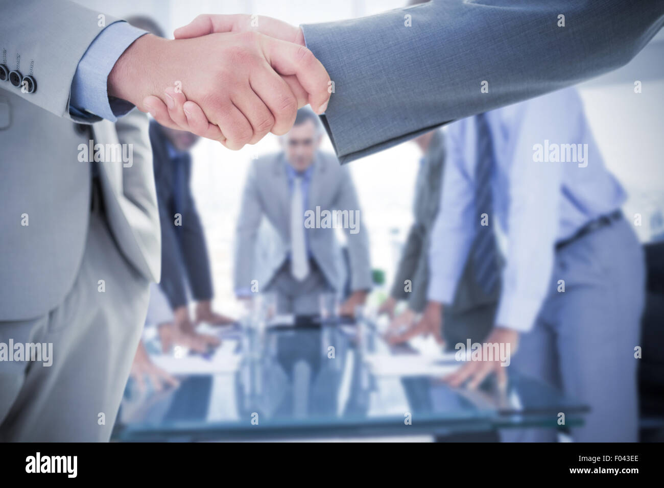 Composite image of business handshake Stock Photo
