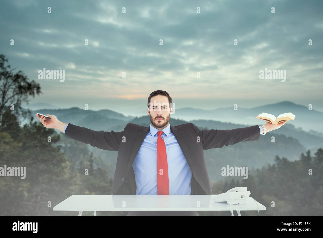Composite image of unsmiling businessman sitting with arms outstretched Stock Photo