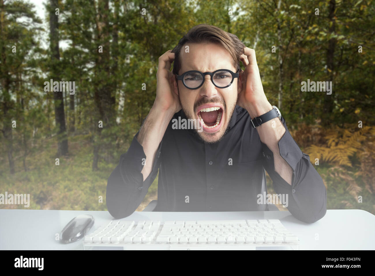 Composite image of businessman yelling with his hands on face Stock Photo