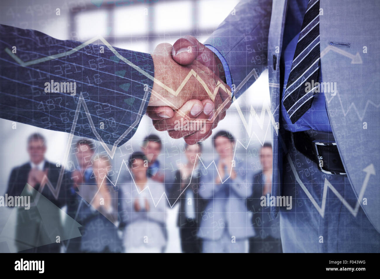 Composite image of  businessman shaking hands with a co worker Stock Photo