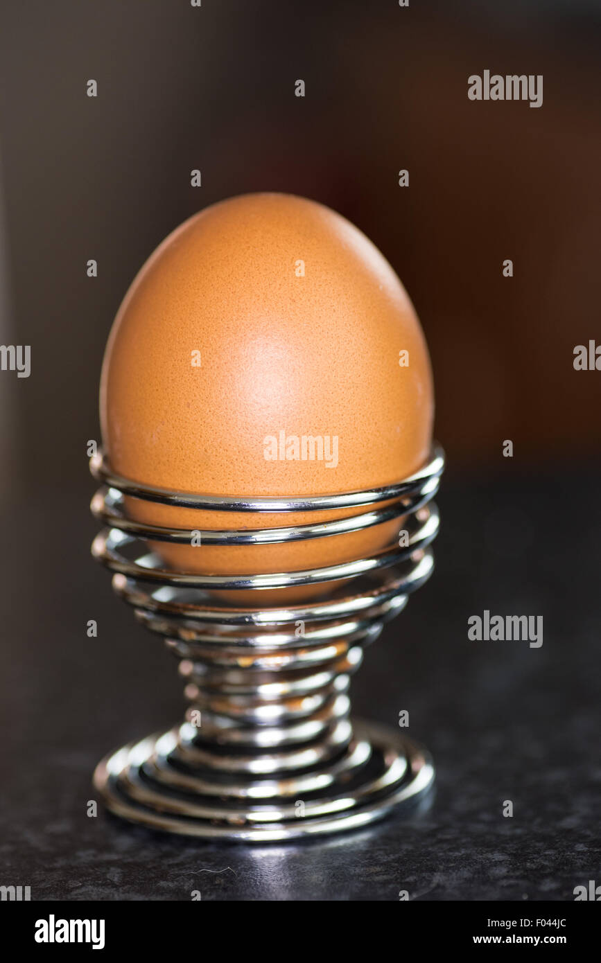 A Boiled Egg in a spiral silver egg cup holder Stock Photo Alamy
