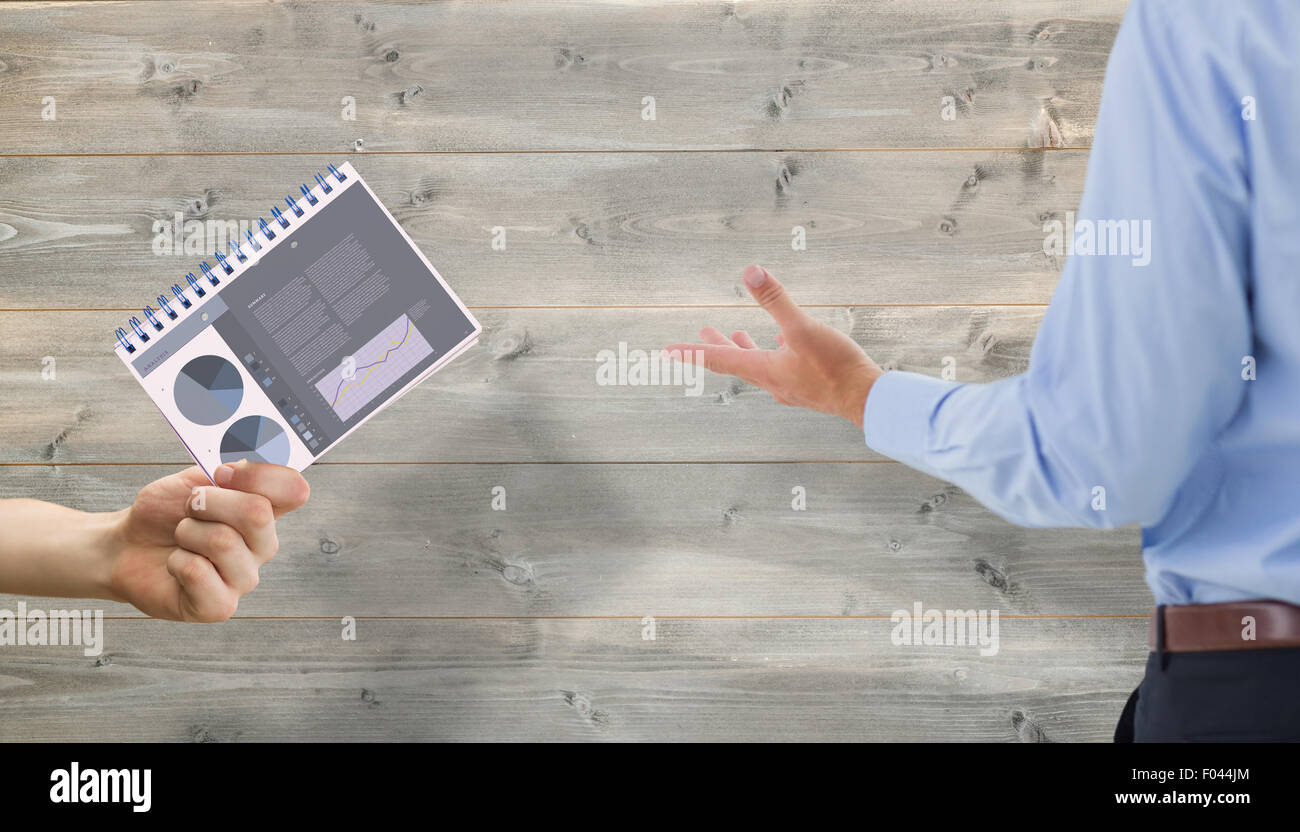 Composite image of businessman presenting with hand Stock Photo