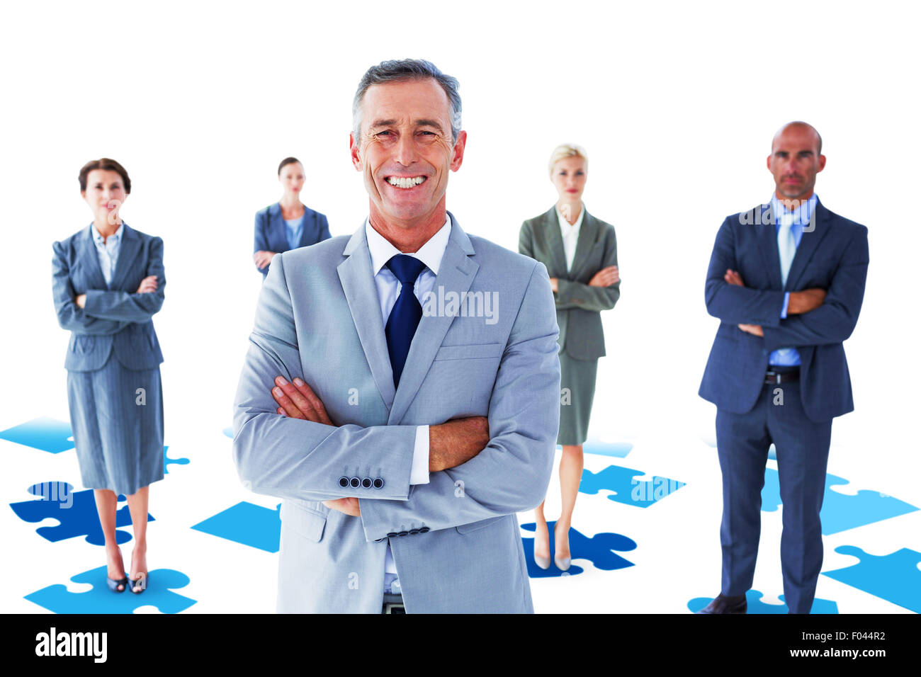 Composite image of businessman colleagues arm crossed Stock Photo