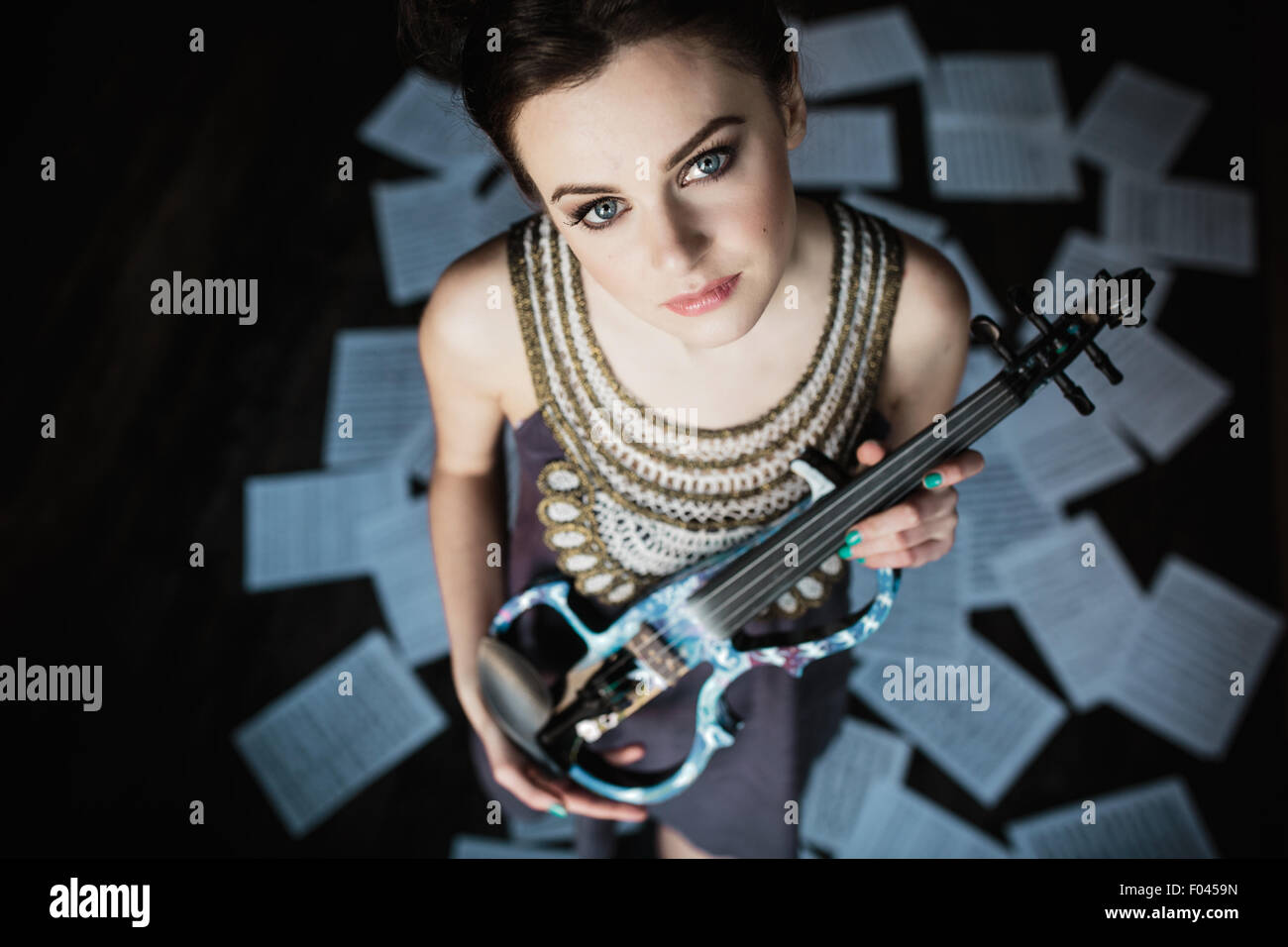 girl posing and holding a violin Stock Photo - Alamy