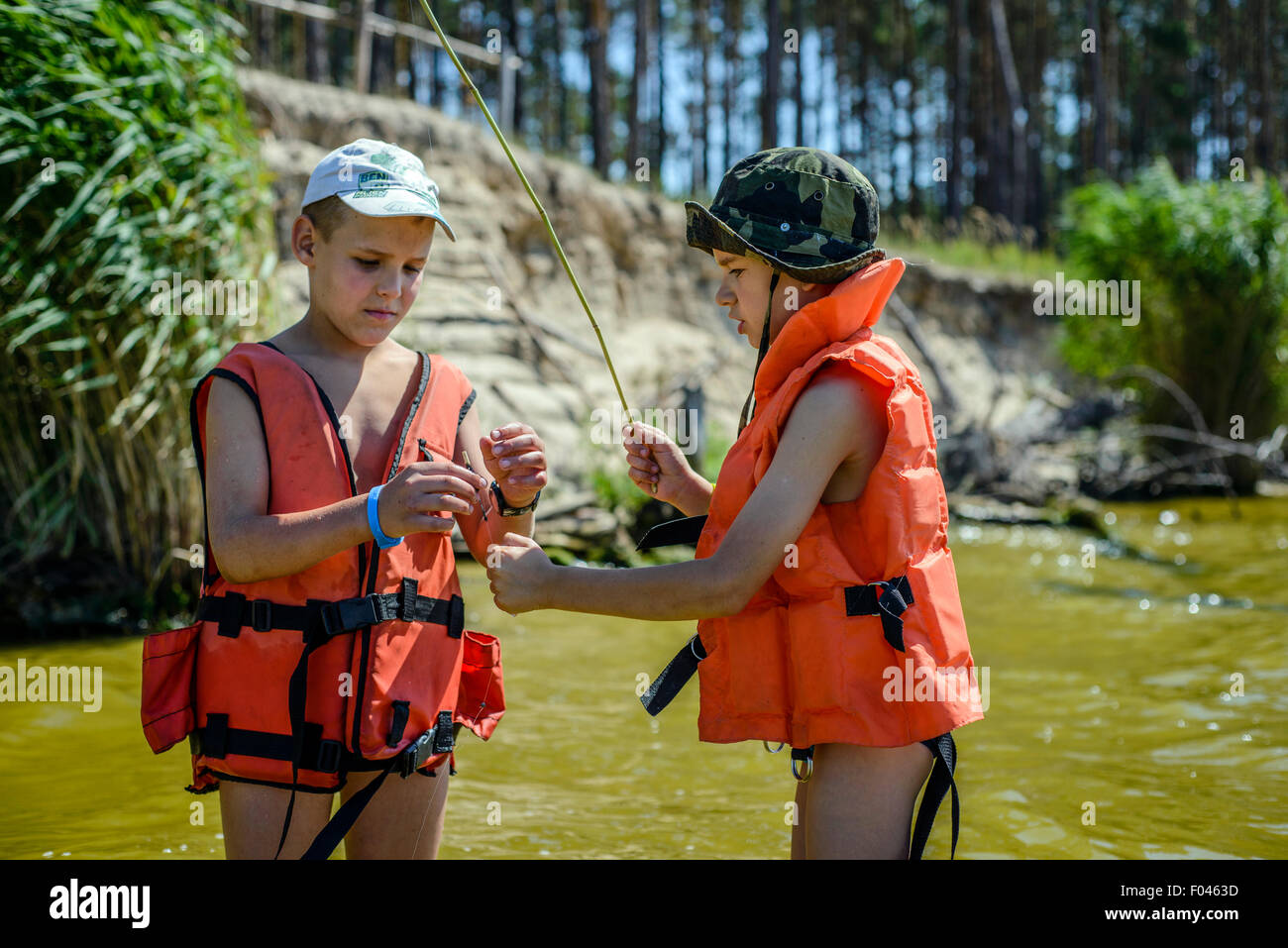 Boy scouts fishing in Ukrainian scout training camp, Kiev region