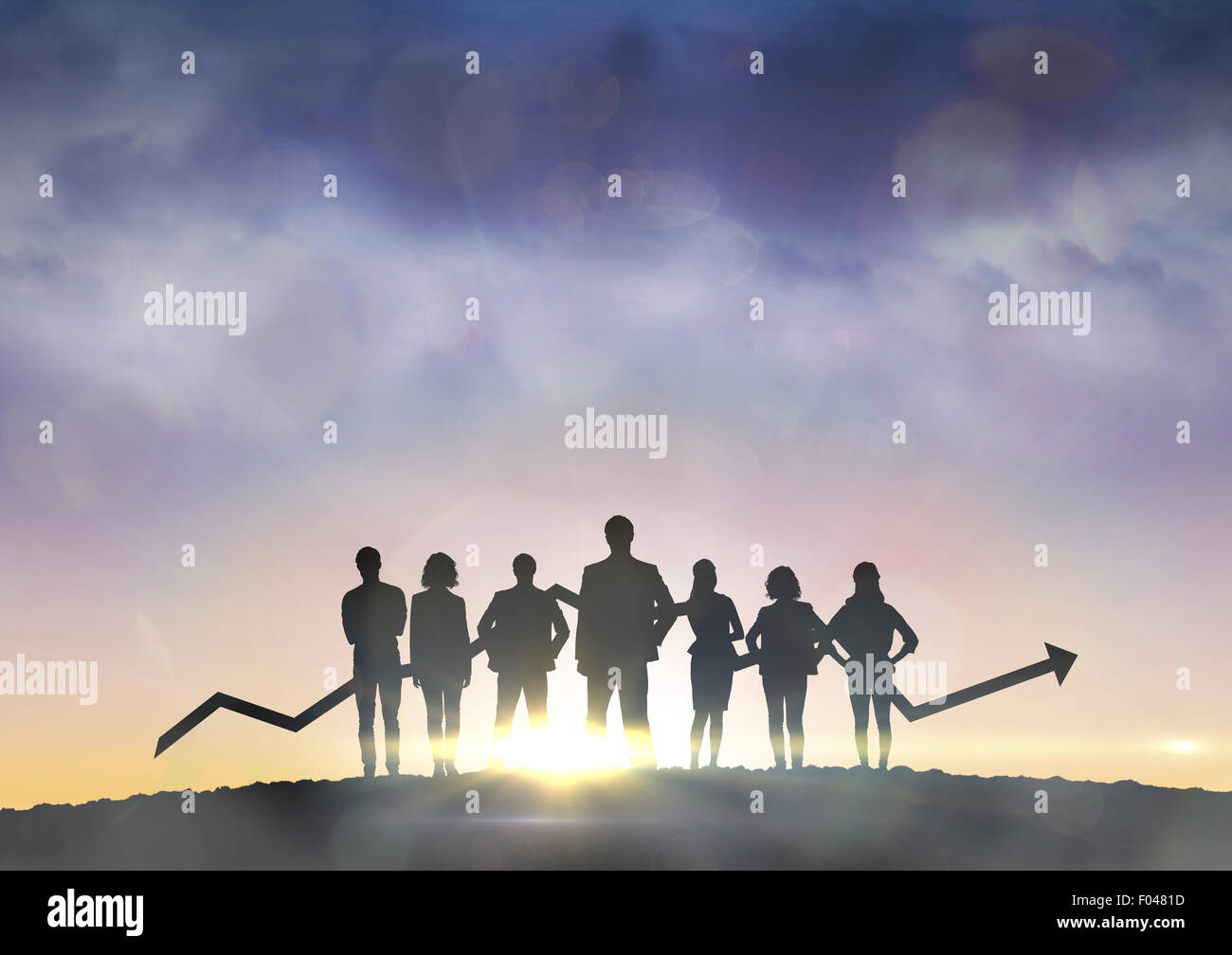 Composite image of business team with arrow Stock Photo - Alamy