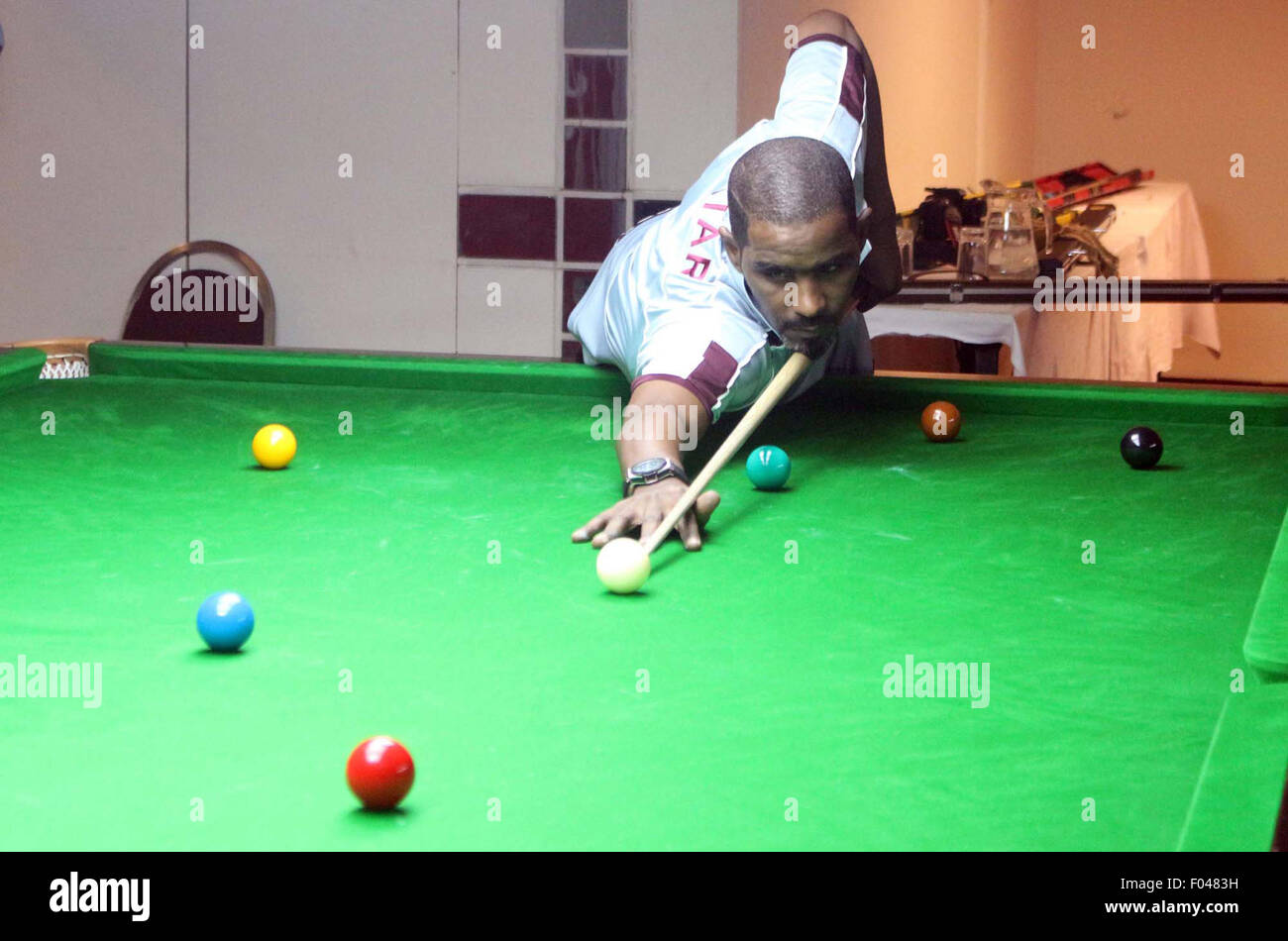 International snooker and billiard board player practicing for SF World 6 Red and Team Snooker Championship-2015 which has been organized at local hotel of Karachi on Thursday, August 06, 2015 Stock Photo