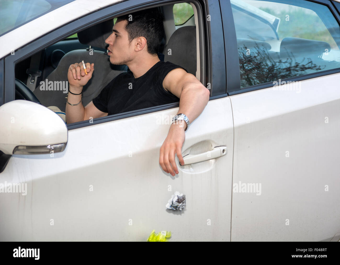 Man throwing litter car High Resolution Stock Photography and Images