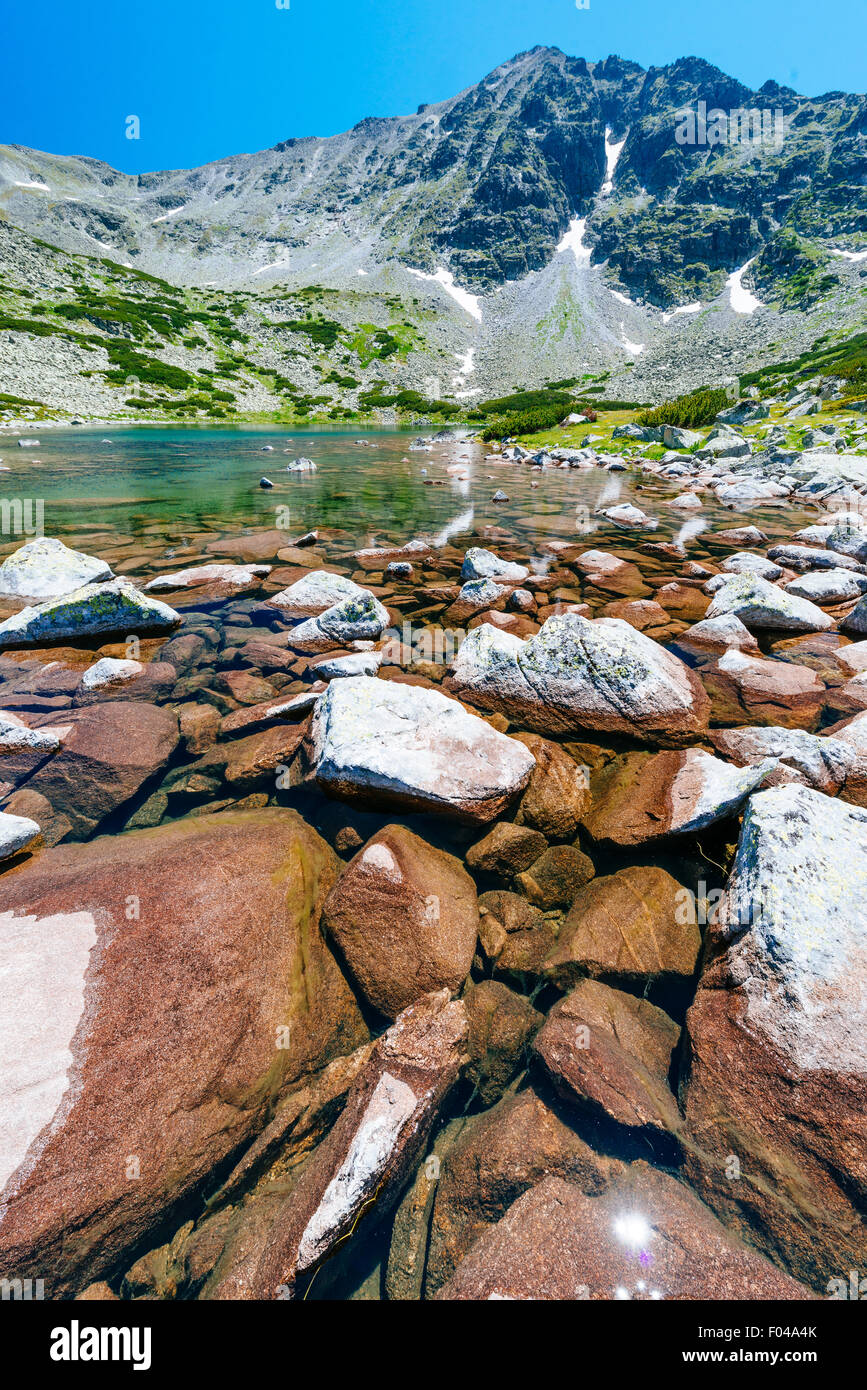 Mountain lake on a bright sunny day on Musala mountain in Bulgaria Stock Photo