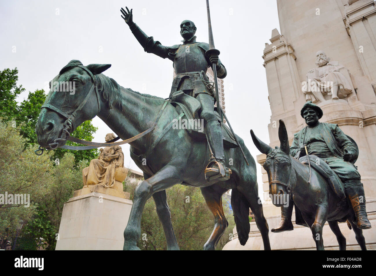 Statues of Don Quixote, knight errant, his horse 'Rocinante', Sancho Panza, in monument to author Cervantes Saavedra, Plaza de E Stock Photo