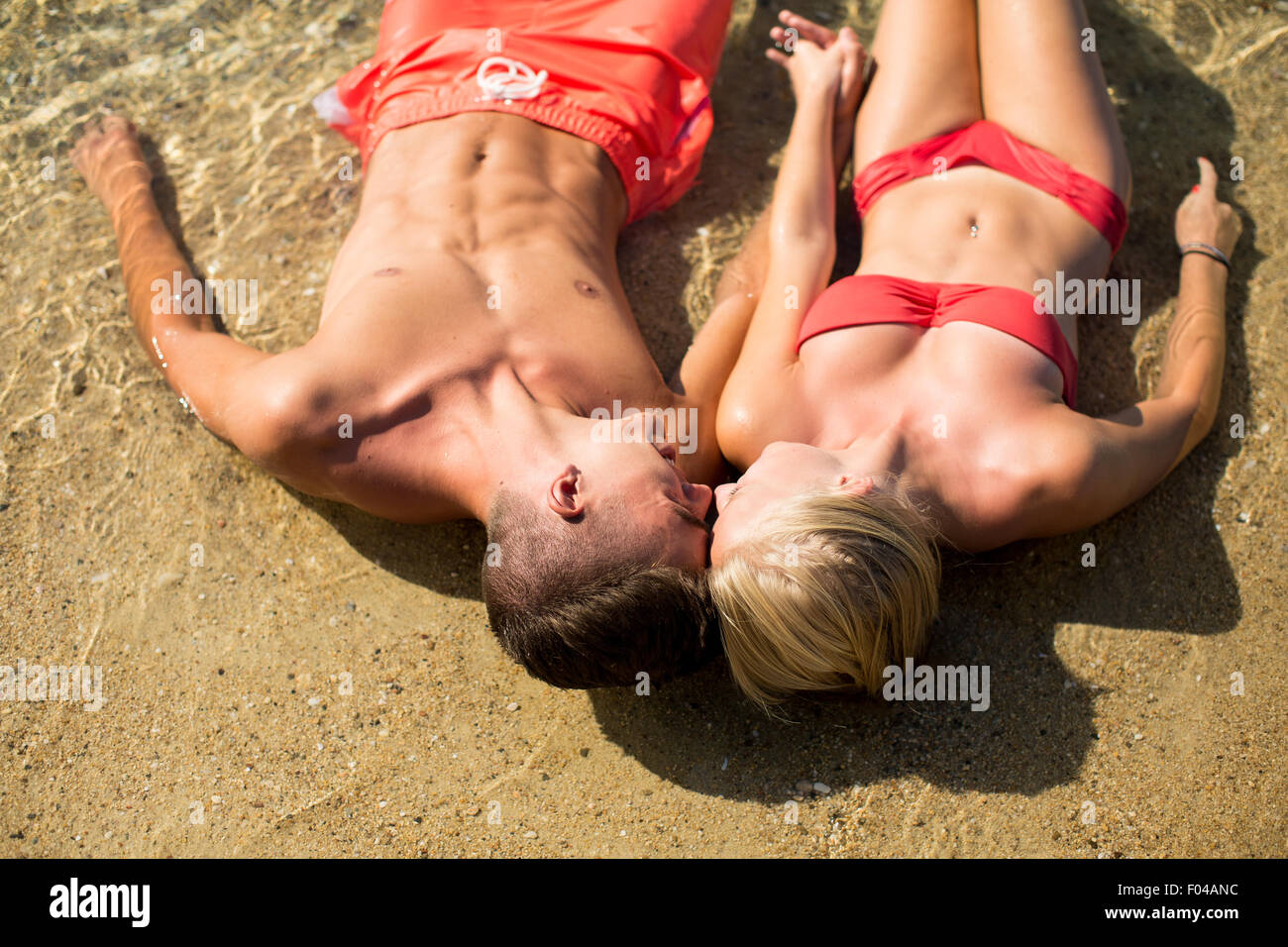 Young couple relaxing on the beach Stock Photo