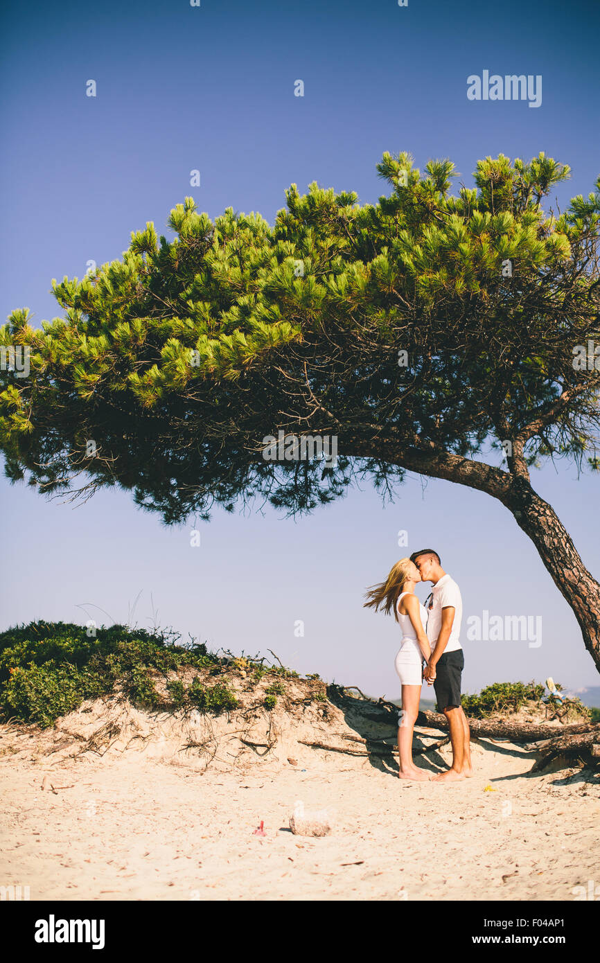 Young couple relaxing on the beach Stock Photo