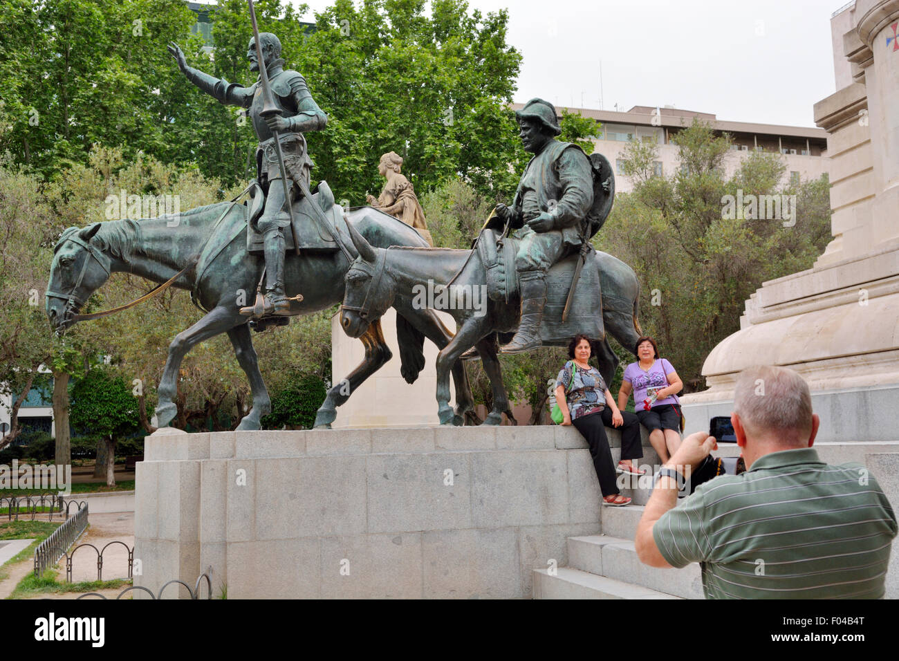 Tourists photographing statues of Don Quixote and Sancho Panza, Plaza of Spain, Madrid Statues of Don Quixote, knight errant Stock Photo
