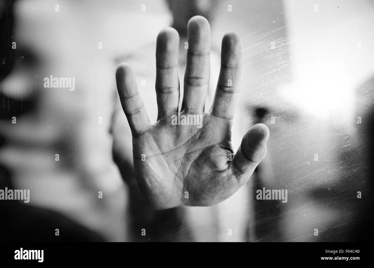 Man showing stop gesture, black and white photo, multiple exposure effect Stock Photo