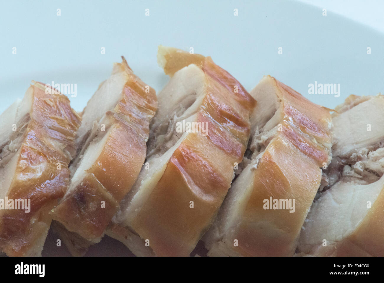 Baked, sliced rabbit meat from the saddle cut Stock Photo - Alamy
