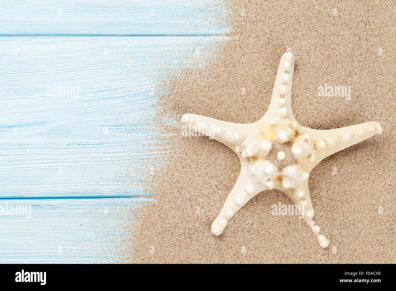 Sea sand with starfish on wooden table. Top view with copy space Stock ...