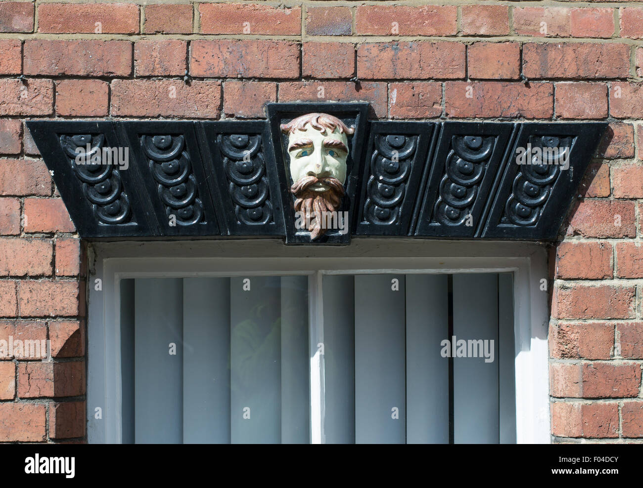 A decorative lintel above a window in Ashbourne, Derbyshire, England