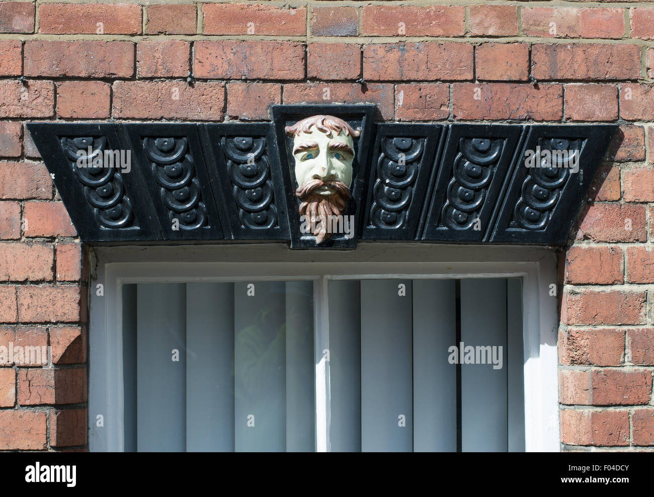 A decorative lintel above a window in Ashbourne, Derbyshire, England, UK Stock Photo