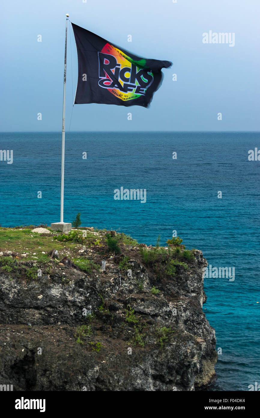Negril, Jamaica - May 30 2015: Ricks Cafe flag on the cliff in Negril, Jamaica. Stock Photo
