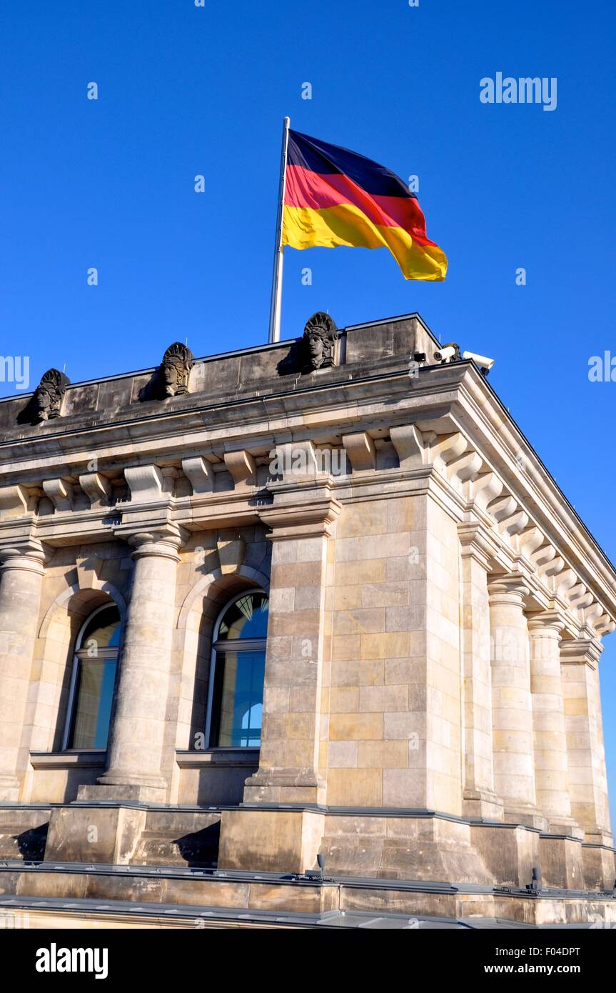 German flag flying over the Reichstag building in Berlin Stock Photo