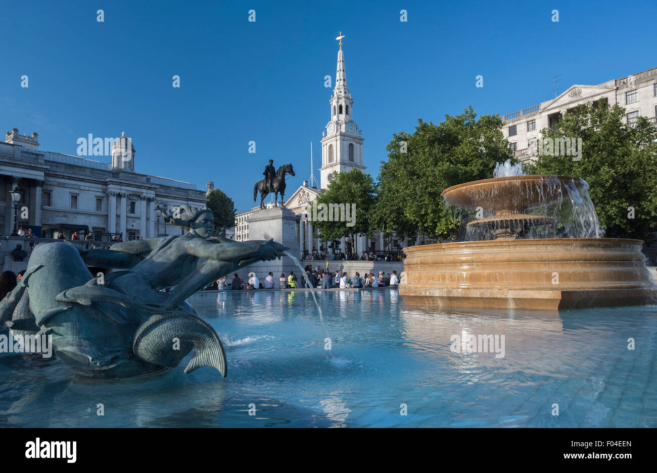 Trafalgar Square fountain and St Martin in the Fields Church London UK Stock Photo