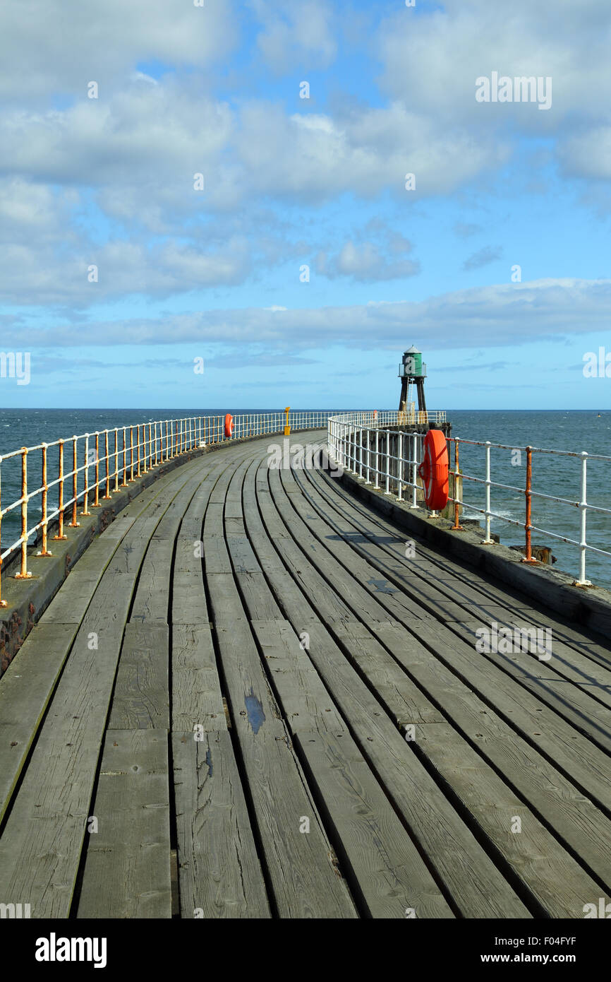 View along the sweeping arch of the end of the pier at Whitby, North Yorkshire, UK Stock Photo