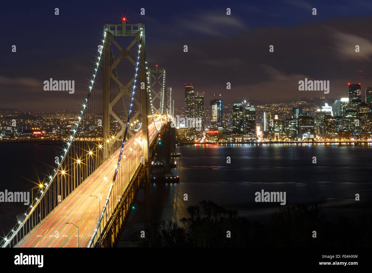 San Francisco Bay Bridge And Skyline At Night With City Lights Stock Photo Alamy