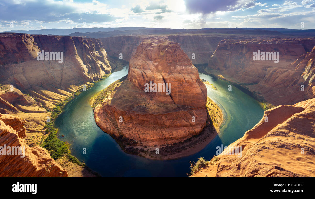 Horseshoe Bend on a sunny day in Page, Arizona Stock Photo