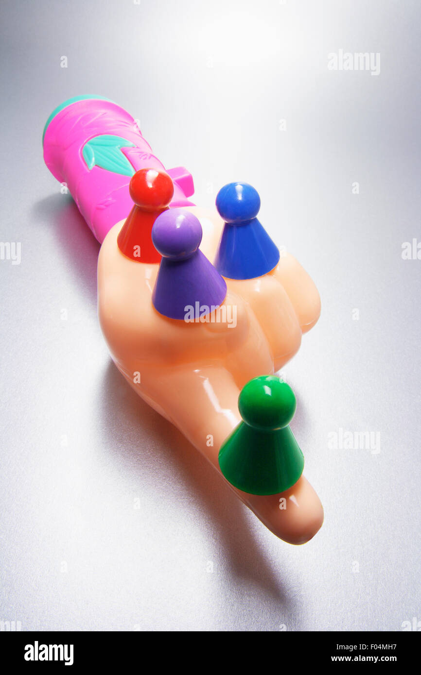 Plastic Hand with Game Pegs Stock Photo