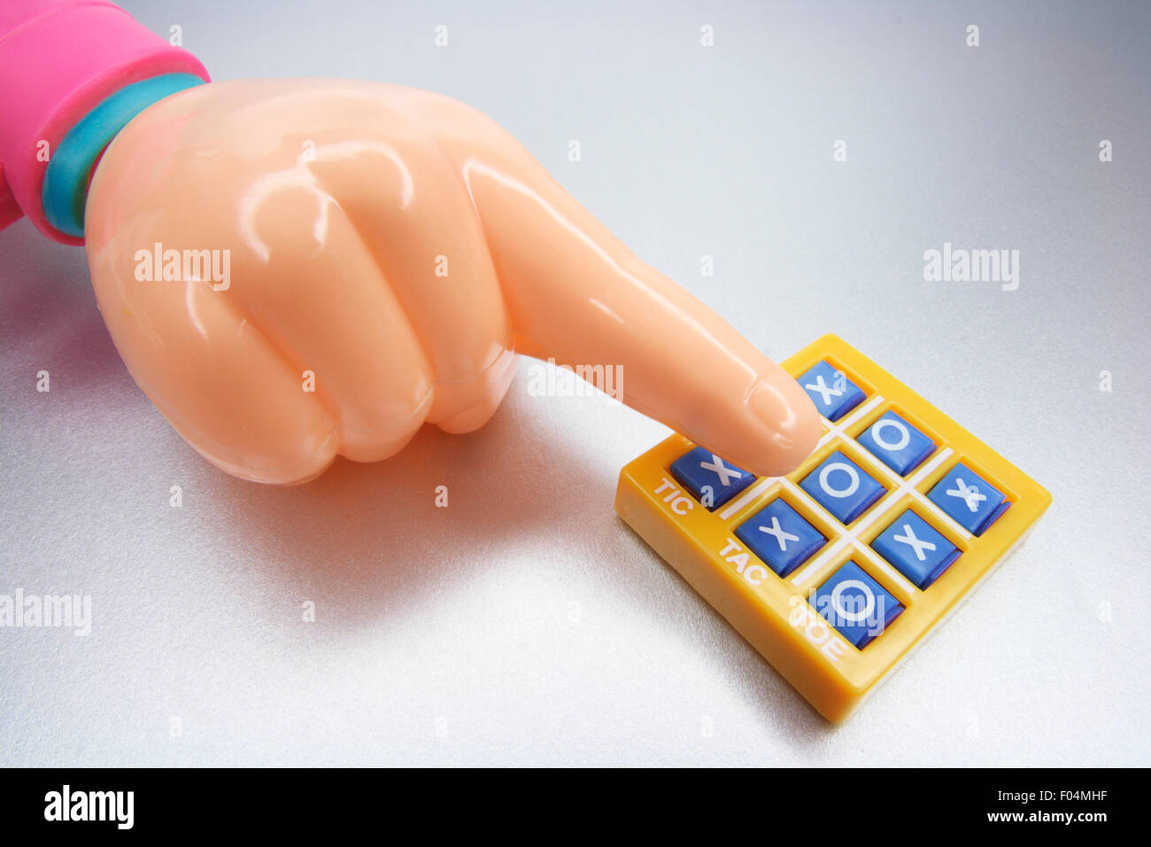 Plastic Hand  and Tic Tac Toe Game Stock Photo