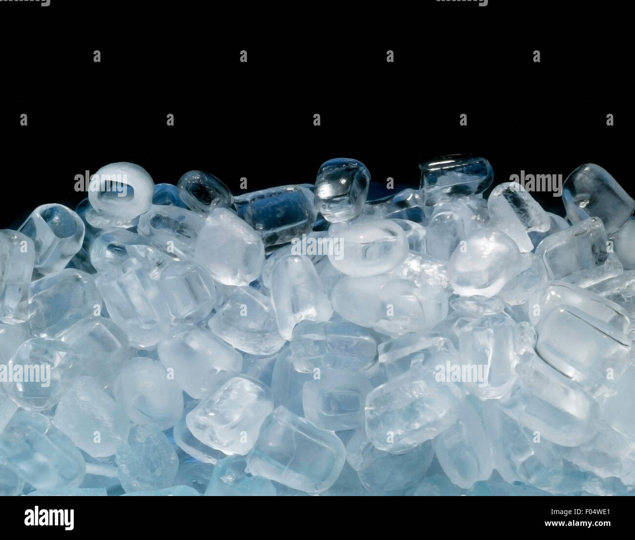 Ice cubes on black background Stock Photo - Alamy