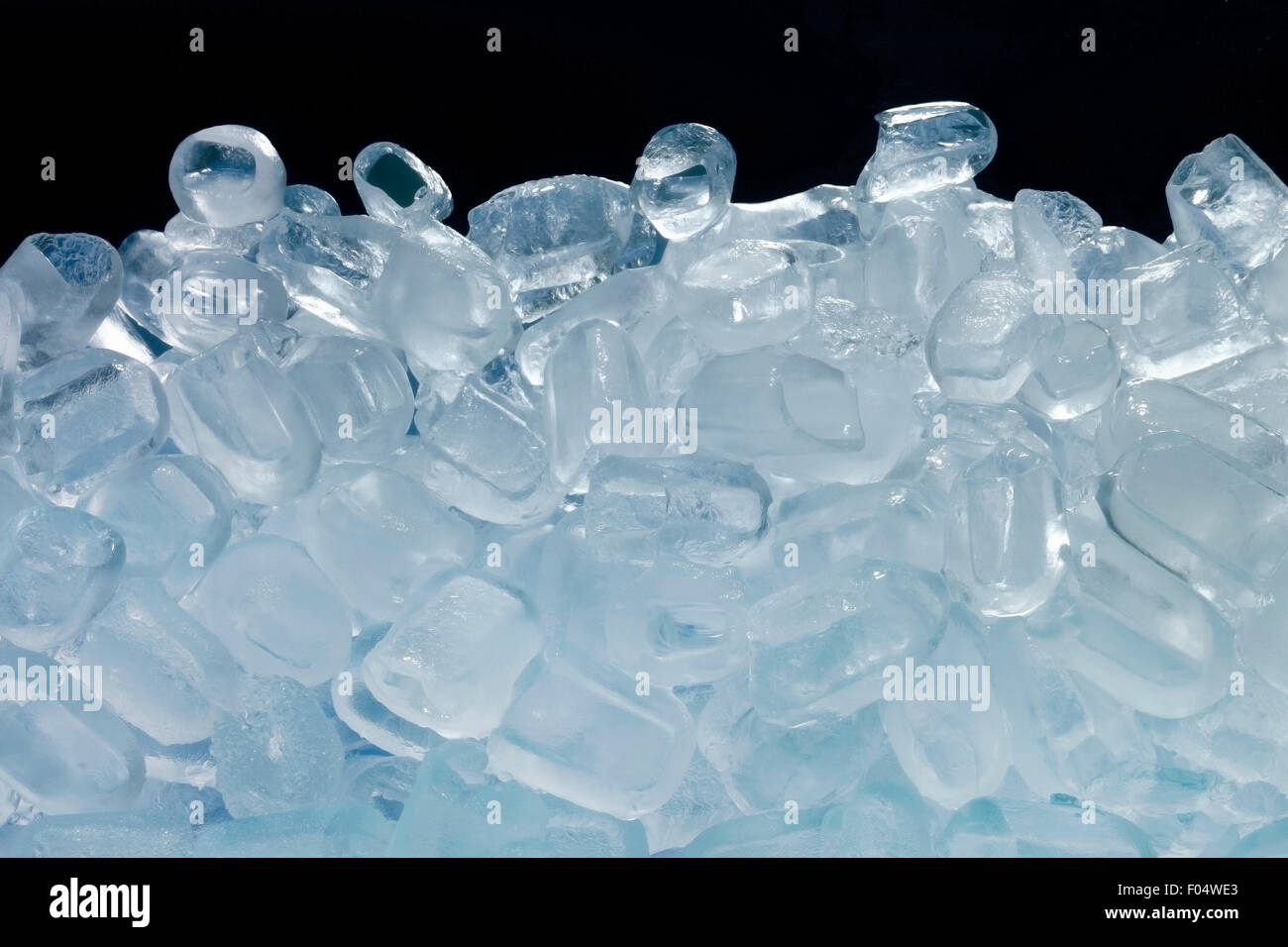 Ice cubes isolated on black background Stock Photo - Alamy
