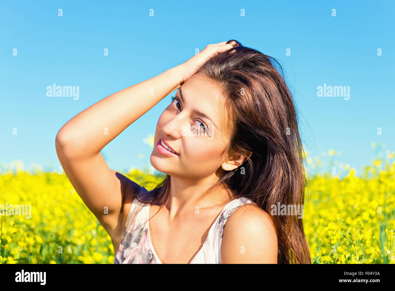 Portrait of a beautiful young woman in the summer on the nature Stock Photo