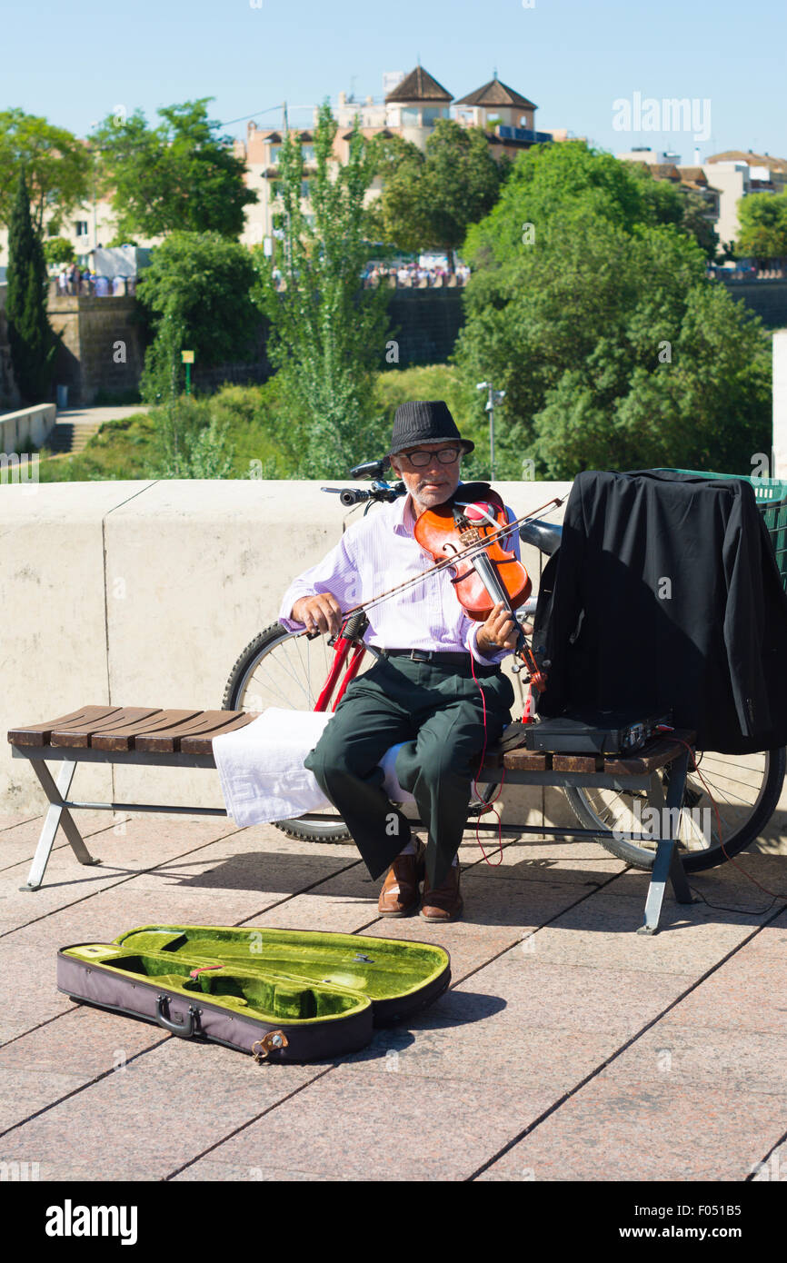 A musician paying the violin in Cordoba or Córdoba, Spain Stock Photo