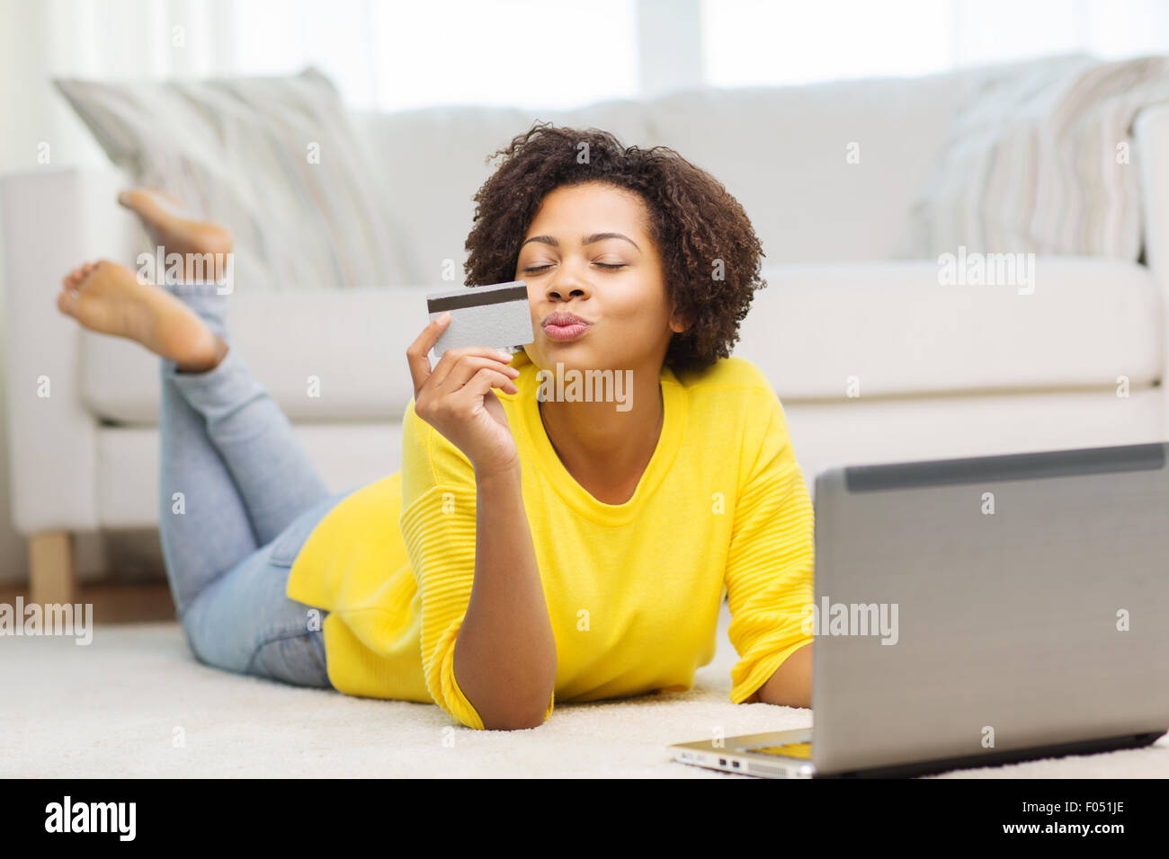 happy african woman with laptop and credit card Stock Photo - Alamy