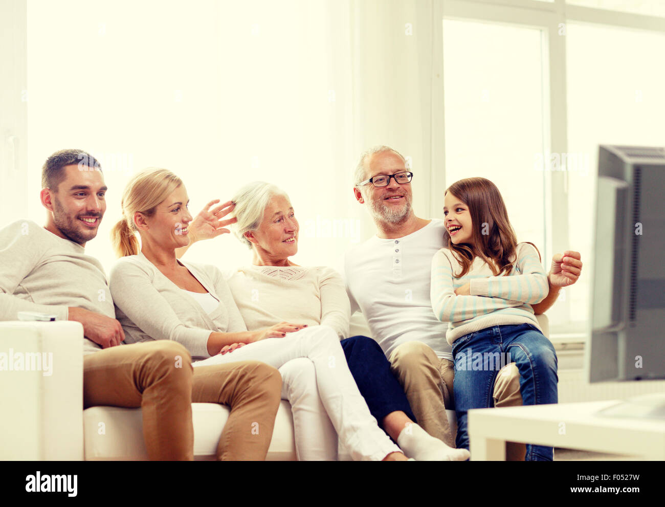 happy family watching tv at home Stock Photo