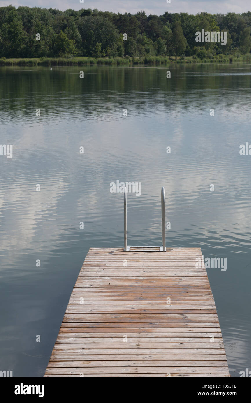 Wooden pier berth in a lake Stock Photo